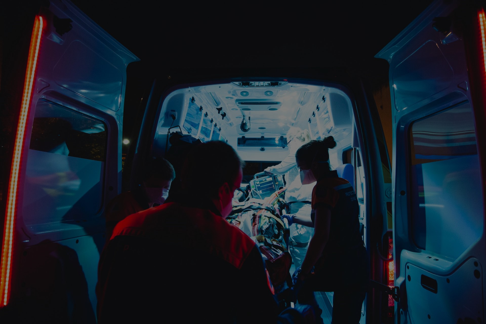 EMS loading a patient into the ambulance